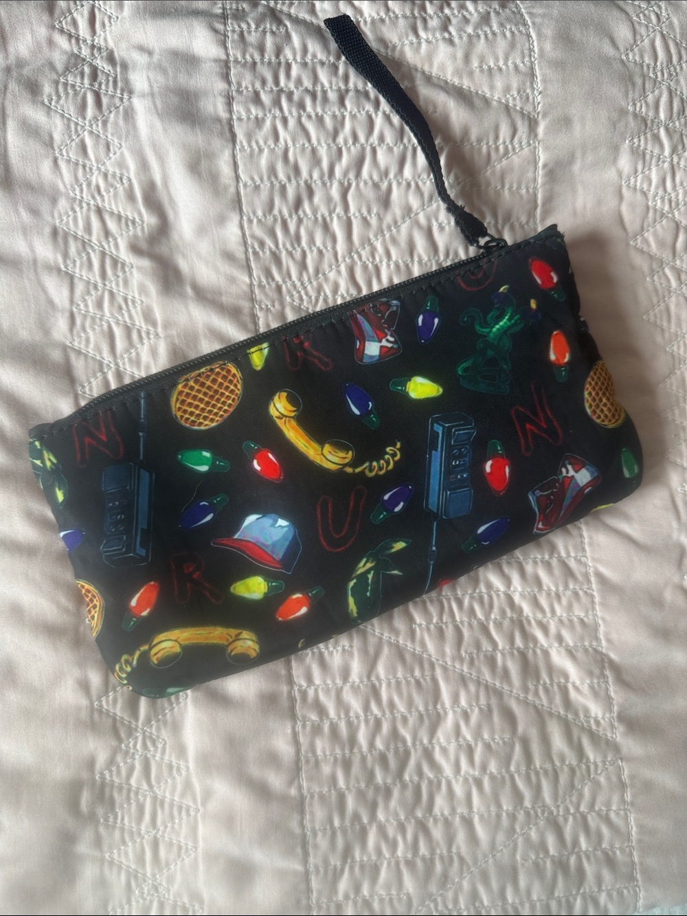 Black Novelty Print Wristlet Pouch with Colorful Icons for crayons